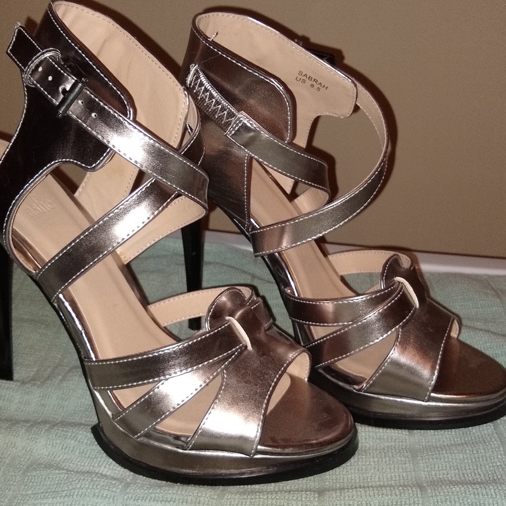 Women's size 8.5 heels/sandals. Color is gun metal